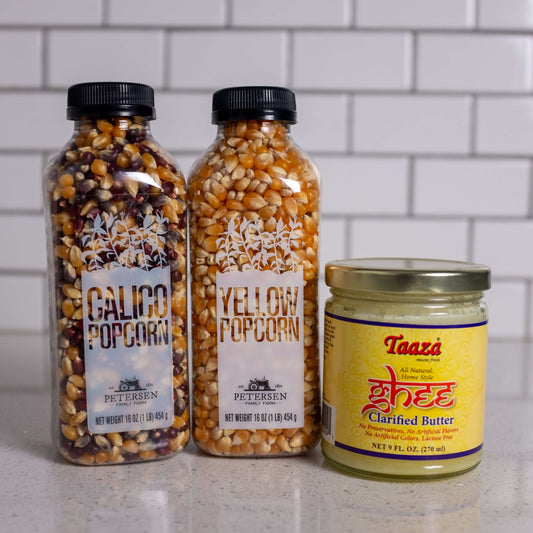 Popcorn set: two kinds of popcorn kernels and ghee for popping popcorn on the stove.
