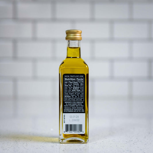 Mini bottle of truffle infused olive oil, back. Finishing oil for topping popcorn.