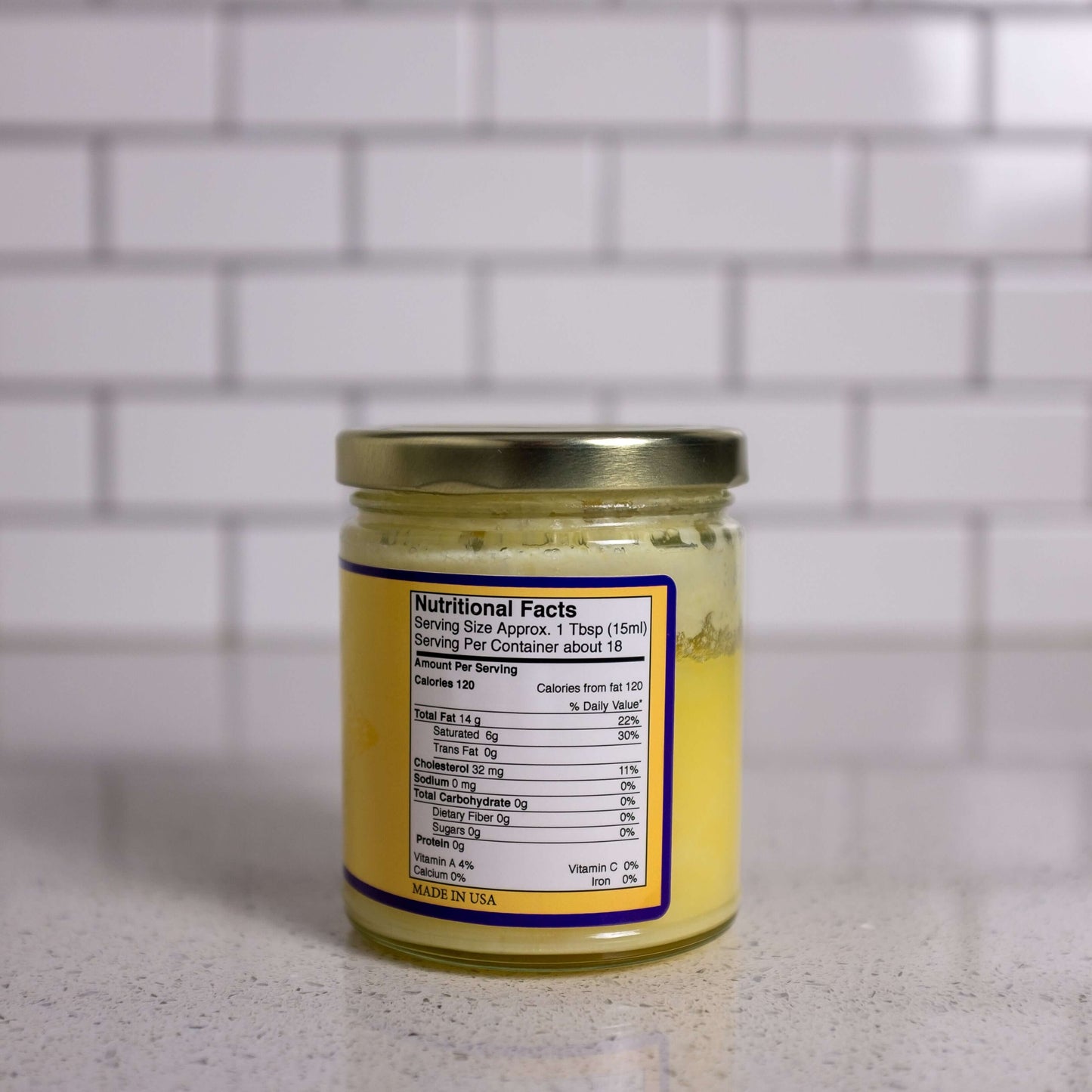 Jar of ghee (clarified butter) for popping popcorn. Back of the jar with nutrition facts.