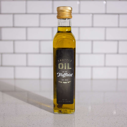 Bottle of truffle infused olive oil, front. Finishing oil for topping popcorn.