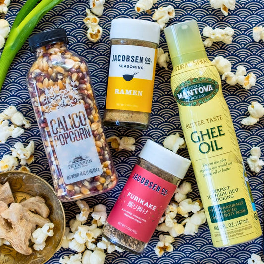 Popcorn flavor set featuring calico popcorn kernels, ramen dust, furikake dust, and a spray ghee.