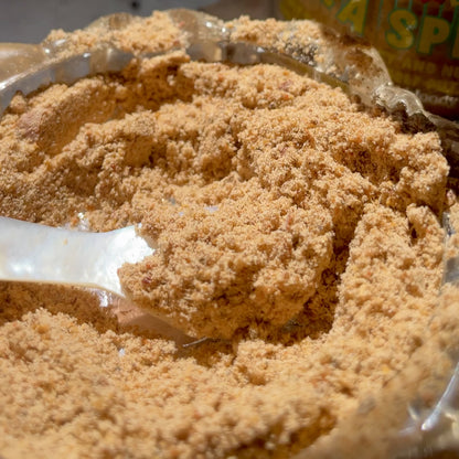 Video of an extreme close up of seasoning mix being mixed around by a caviar spoon.