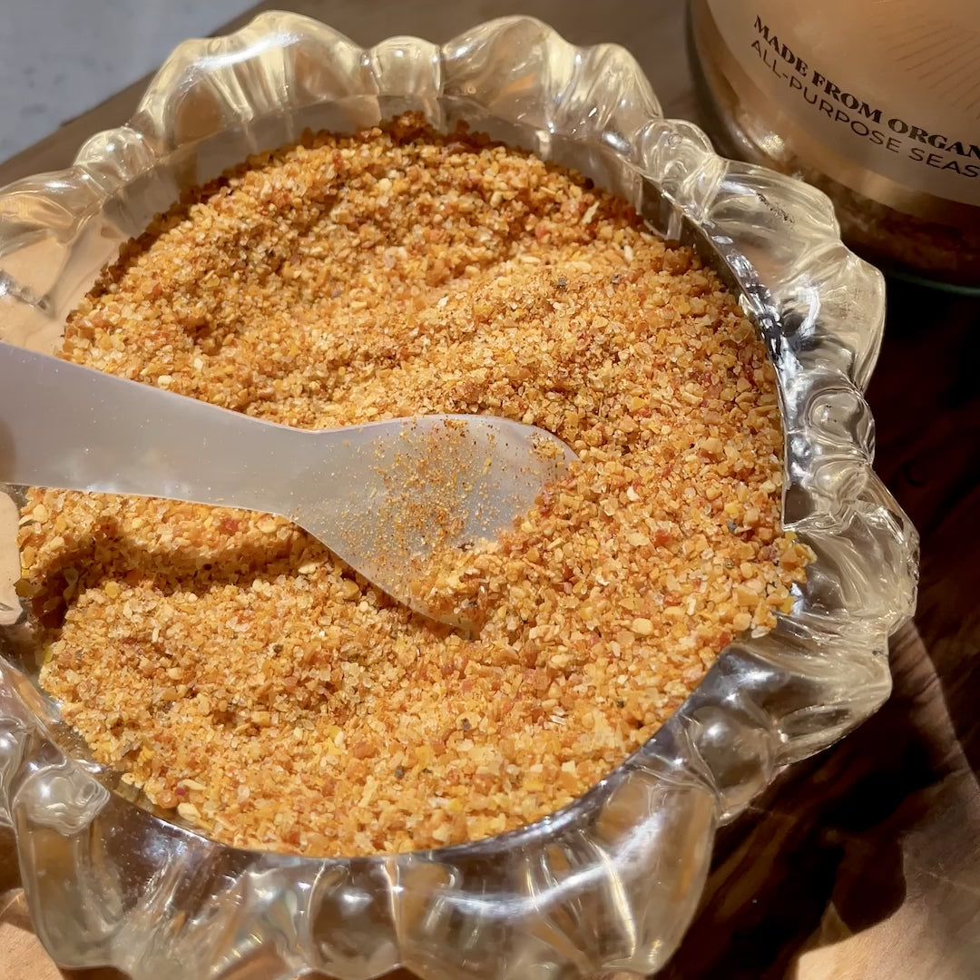 Video of an extreme close up of Desert Dust spice mix being mixed around by a caviar spoon.